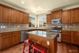 Oversized kitchen that features granite countertops, Stainless steel appliances and great storage space.