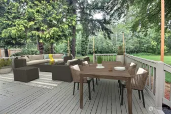 Endless possibilities await you on the expansive, virtually staged deck, offering serene views of the sprawling backyard. The outdoor space is perfect for relaxing, entertaining, or creating your own personal oasis.