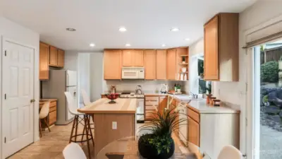 Kitchen offers easy access to the backyard, both dining spaces, open sight lines to the kitchen and a built-in desk making this the heart of the home.