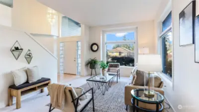 Bask in the natural light from the wall of windows in this cozy formal living room featuring a wall of windows.