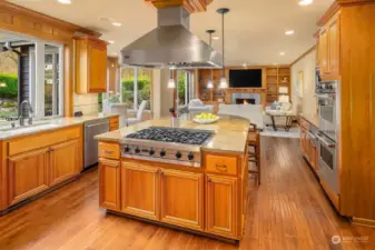 The Chef's kitchen ~ massive granite seating/prep island, SubZero refrigerator, a full Viking appliance package including double ovens, warming drawer, and a commercial-grade 6-burner range and vent hood, along with abundant cabinet and countertop space.