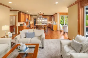 The adjoining family room with fireplace and a wall of built-in shelving.  The surround sound speaker system is provided here, in the kitchen, office, primary bedroom and bonus room.