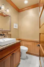 Main floor powder room with vessel sink.