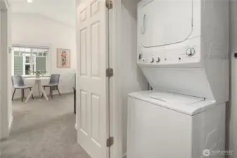Across from the bathroom is the laundry area, with double door access and some extra storage (just out of view).