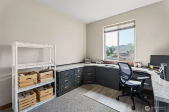 Bedroom 1 in front of house, set up as office.