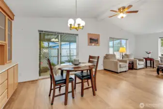 Another angle of the dining space which can hold a much larger table than displayed. Sliding glass door leads to a wonderful large covered patio.