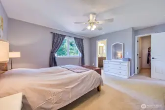 Spacious primary with ensuite bathroom and walk in closet.
