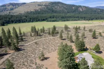 Manicured Methow trails skirts the edge of the property. This combination of privacy, acreage , close to town and trail access is almost impossible to find!
