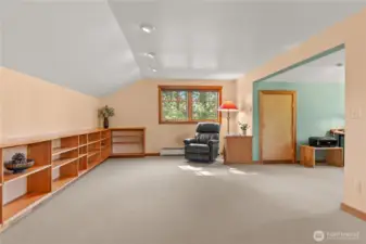 Bright and sunny flex-bonus space. Gorgeous vertical grain fir built-ins end clutter and gives unity to the room!