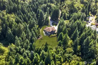 Tucked away on 10 private, sun-drenched acres in one of North Bend’s most coveted communities—just minutes from trails, rivers, vibdowntown, and I-90
