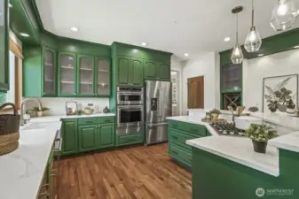 Magazine-worthy remodeled chef’s kitchen with quartz countertops, SS appliances (gas cooking!), wine fridge, custom tile backsplash, and high-end finishes throughout.