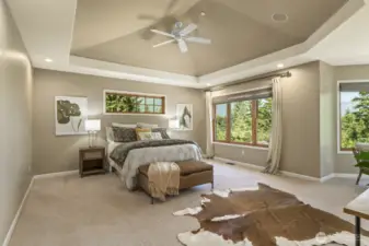 French doors open to the expansive primary bedroom with vaulted coffered ceiling, custom blinds and spectacular views.
