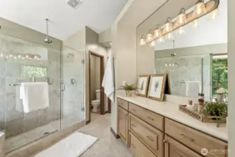 Beautifully designed primary 5-piece spa-like bath featuring a private toilet room, linen closet, rain shower, deep tub and extra vanity cabinet for added storage.