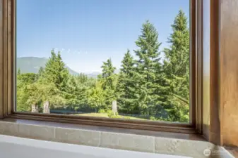 Soak in the views—literally. Enjoy breathtaking Mount Si & Cascade vistas right from the tub, just one of many stunning outlooks featured throughout this unforgettable home and property.