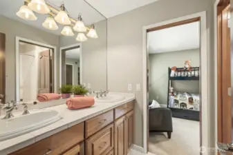 Jack & Jill bathroom thoughtfully connects Bedroom 1, the media room, and another bedroom—perfect for flexible living and guest comfort.