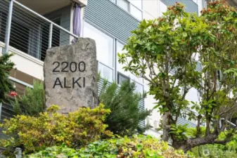 Well-managed building with exterior updates and mature, manicured landscaping