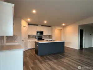 Kitchen and hallway to Primary Suite
