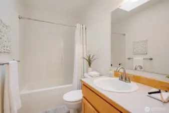The full bathroom upstairs is conveniently located between two bedrooms.