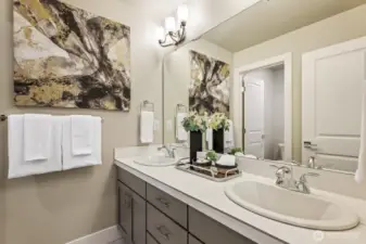 3rd floor main bathroom featuring upgraded tile, including shower tile walls all the way to the ceiling and tile counters.