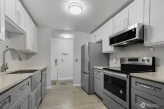 A view from the galley kitchen towards the front door.