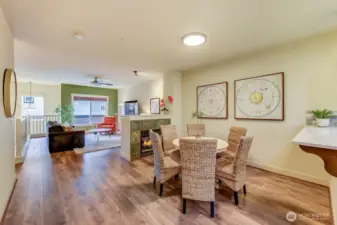 Looking out from the kitchen over dining area and living area (double sided gas fireplace)
