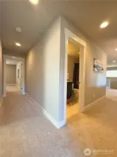 Upstairs hallway; bedrooms to the left, loft to the right