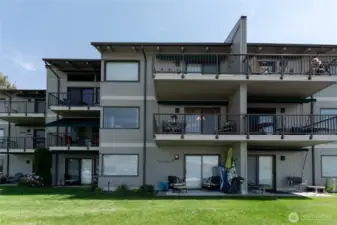 Exterior view of unit with large lake view deck.