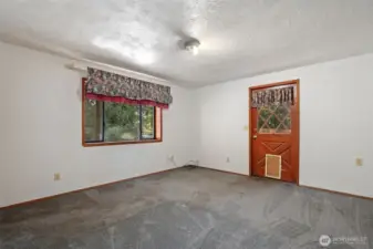 Lower floor bedroom #2 with walkout door to pool area.