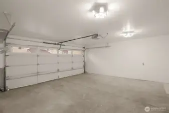 Two car garage with storage shelves. With driveway, park up to 4 vehicles!