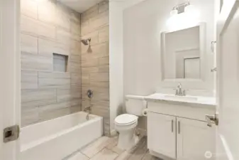 Main floor full bathroom off entryway