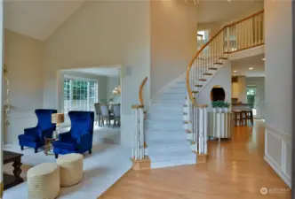 Dramatic Entry/Foyer with vaulted ceiling, stairway to 2nd Fl, lots of natural lighting!