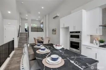 Kitchen features island with eating space (photos of lot34, same floorplan)