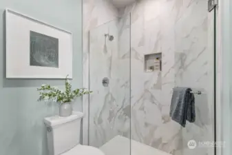 Gorgeous tile shower and frameless door!