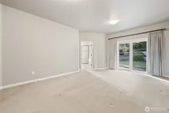 Primary Bedroom with sliding glass doors overlooking the patio with hot tub hook up