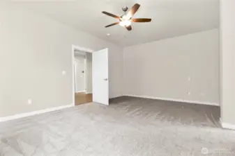 primary bedroom with ceiling fans