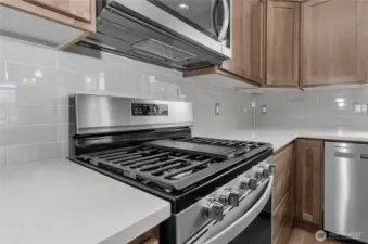 sleek and modern backsplash and quartz counters