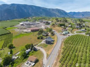Aerial view of property w/ surrounding orchards.