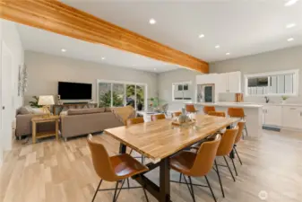 View 1 of the dining room designed to comfortably sit 8 guests that overlooks the living room & sitting area w. sliding glass doors leading out to the large lake view deck.