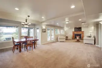 Basement dining area off kitchen has plenty of space for a large dining table
