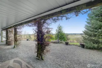Lower level gravel patio has a fire pit and tons of space to play