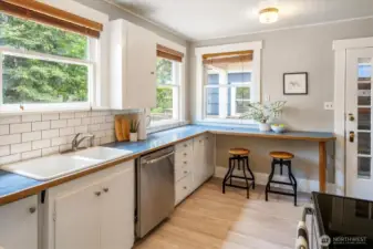 Another view of the light-filled kitchen with door to the backyard deck.