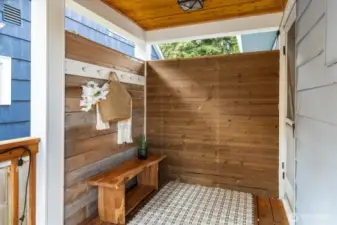 Covered back porch leading into the kitchen.