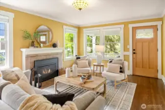 The living room features refinished hardwood floors, gas fireplace and tons of natural light.