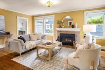 Another look at the living room, fireplace and door to the kitchen.