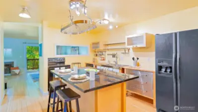 What a showstopper of a kitchen! Bright, functional, and full of charm - complete with a hanging pot rack that makes cooking feel as fun as it looks.