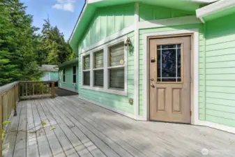Enjoy the beauty of drought-resistant landscaping from the comfort of your private deck, offering a low-maintenance and serene outdoor retreat.