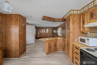 Looking from Kitchen to breakfast bar and living room area