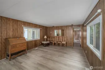 Living room area... desk, chairs and table in kitchen can stay