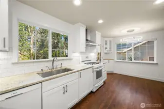 Beautifully updated kitchen & dining area, the door leads out to large deck that overlooks backyard.