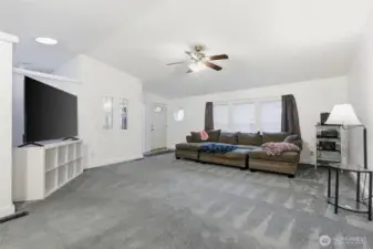 View of living room and entry from dining area